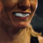 Athlete wearing a white custom sports mouthguard
