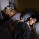 Man sleeping comfortably in bed